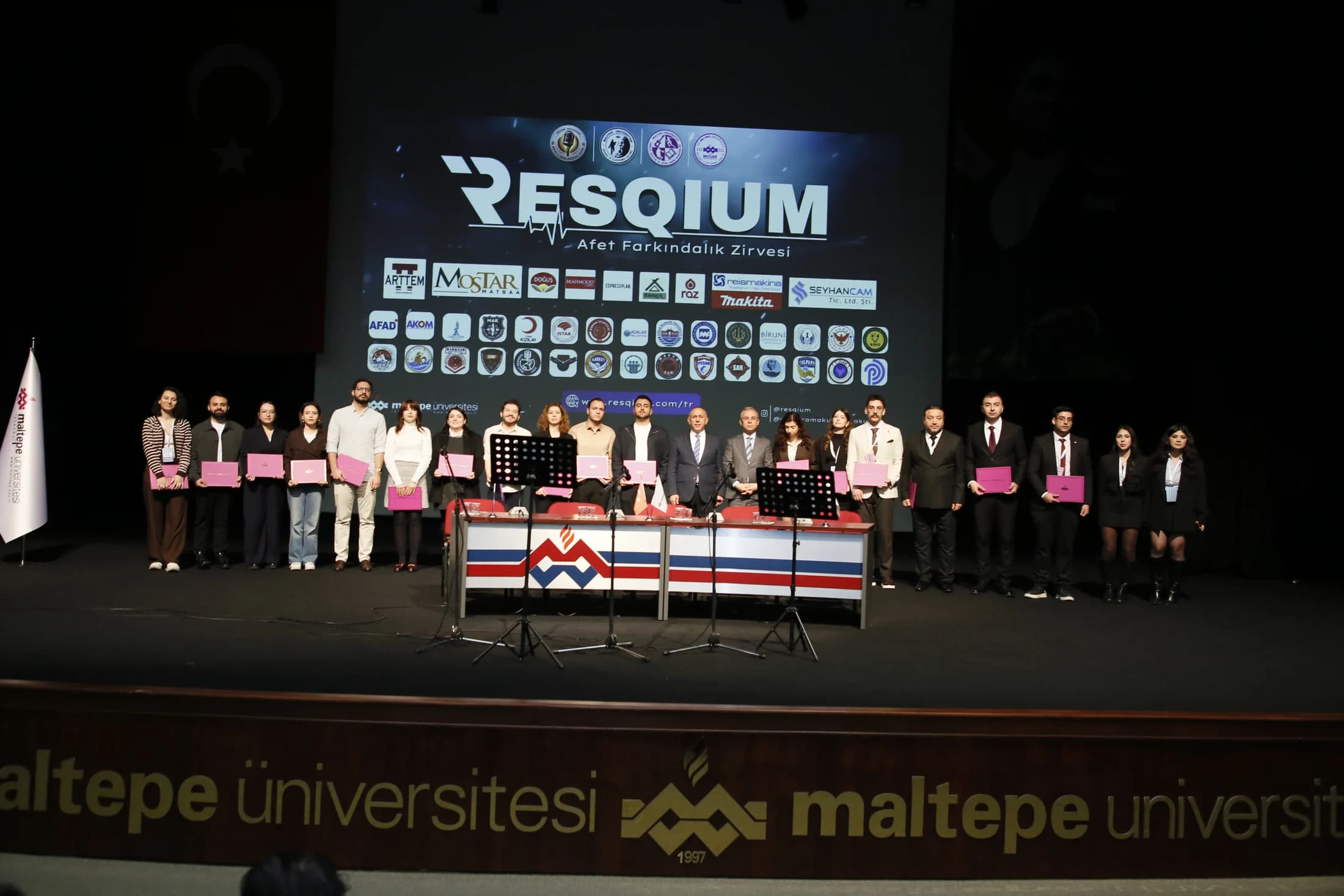 A group photograph on stage during the opening programme